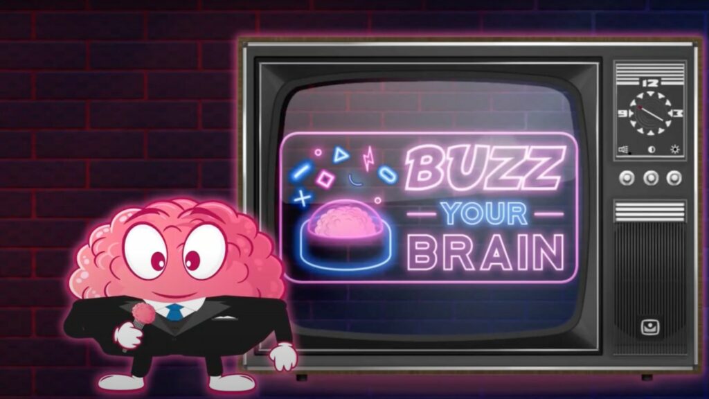 un cerveau en figurine qui parle dans un micro à côté d'une télé